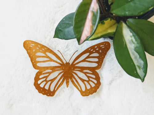 Place this butterfly on any bright window and watch as the rainbows shine in throughout the day. The copper colour of this window decal means it will go with any decor. The metallic sheen gives it a more glamourous look while the neutral tone blends perfectly with any boho bedroom, living room or nursery.
