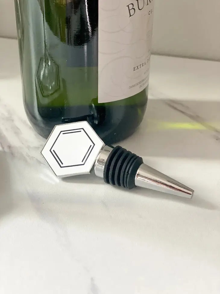 Who said wine connoisseurs can't also love aromatic molecules? With the Chemistry Wine Stopper, now you can make a scientific statement when hosting your next party! This charming kitchenware is designed like a hexagonal Benzene molecule, with its silver-plated finish sure to delight any science or chemistry professor - or geek - in your life