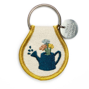 Show your keys some love with one of our patch keychains. Super cute and eye-catching, our double-sided embroidered keychain designs range from flowers and strawberries to sheep and chickens - which makes me think we pretty much got it all covered. Made with high-quality materials for a durable, long-lasting accessory. "Watering Can" Retro Inspired Great gift Your new favorite accessory Embroidered Natural Cotton Patch Keychain Double-Sided Embroidery Metal Split Keyring. 2.5" x 1.5"