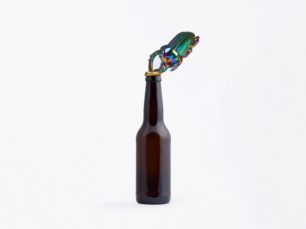 Quirk and elegant metal bottle opener shaped as a beetle. Its handy function is merged with its insect shape. 