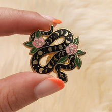 Load image into Gallery viewer, This magical snake enamel pin is intricately detailed with the moon phases &amp; gorgeous pink flowers winding it&#39;s way through the serpent. 
