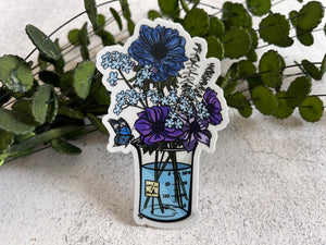 This is a sticker of my digital painting including an Erlenmeyer Flask filled with Forget Me Nots, Purple Anemones, Eucalyptus, and a Blue Dahlia!