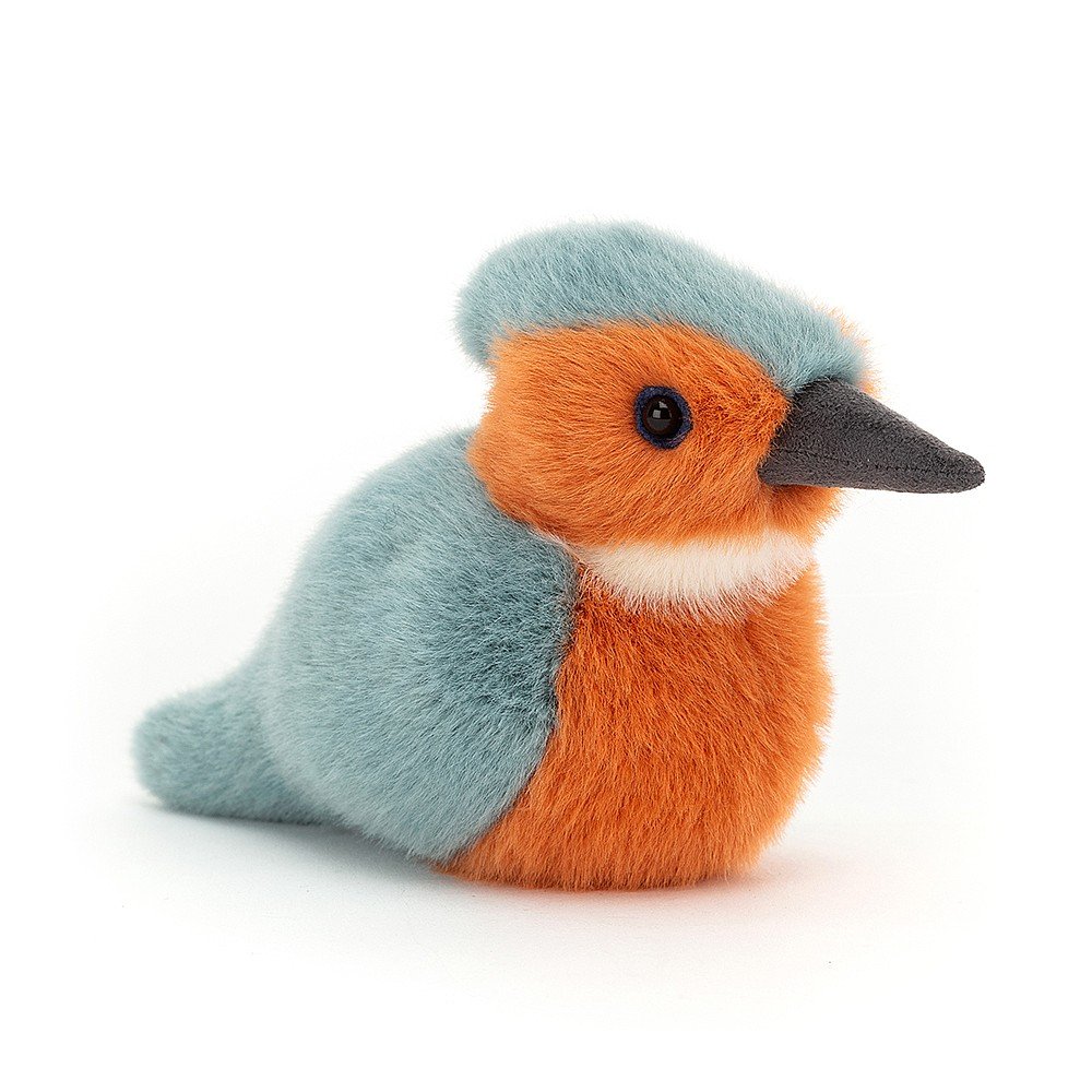 Birdling Kingfisher loves perching patiently, waiting to spy some dinner in the river! This striking scamp has soft, bright fur in pastel blue, rust-red and cloudy white, with a keen bright eye and a cool grey beak for scooping up fish!